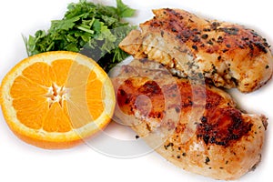 Seasoned roast chicken with orange and green