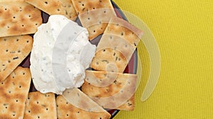 Seasoned rosemary and olive oil crackers with dip