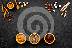 Seasoning for cooking desserts. Cinnamon, cocoa, badian on black background top view space for text