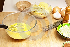 Seasoning whisked eggs in a boal photo