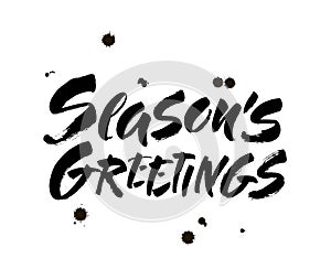Seasons greetings calligraphy lettering text on white background with vintage paper texture. Retro greeting card for Christmas and
