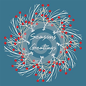 Seasons Greetings festive wreath on a blue background
