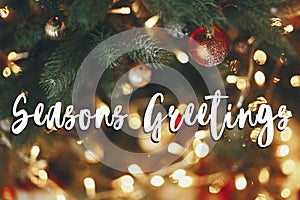 Seasons greetings text, beautiful stylish christmas tree with ga