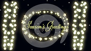 Seasons Greetings text and fairy lights against glowing stars on black background