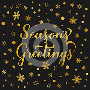 Seasonâ€™s Greetings glitter textured lettering gold snowflakes, stars and dots on black background. Christmas and New Year