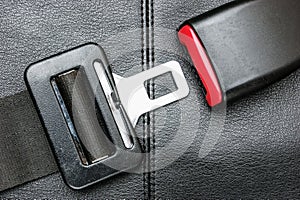 Seat belt on a black leather