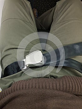 Seat belt on a passenger on an airplane