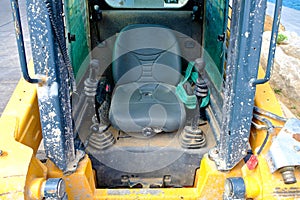 A seat in a heavy road building machinery.
