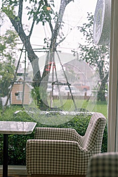 A seat with raining background and green grass