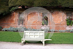 Seat & wall with alcoves at Powis Castle garden in England