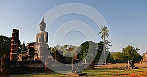 Seated Buddha  at Wat Si Chum temple in Sukhothai Historical Park, Thailand.