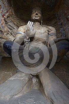 A seated buddha in Yungang caves , grottoes, Datong