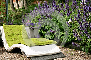 A seating area in a homey, ecological garden.