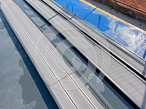 Seating area for spectators made with composite deck next to the tennis court