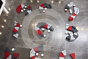 Seating in the atrium of modern university building, aerial