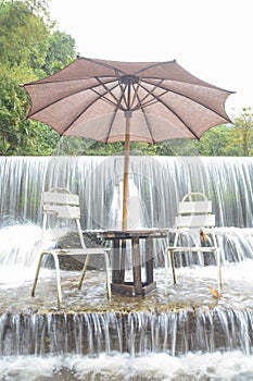 Seating in waterfall ,relax time at Mae Kampong waterfall in Thailand