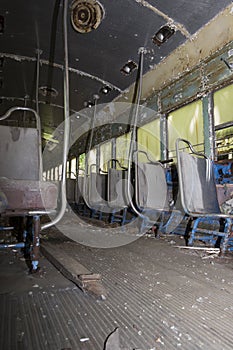 Seats on aisle of abandoned trolley car