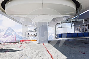 Seats and the mechanism of the cable car high in the mountains. Active lifestyle and winter sports