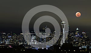 Seattle downtown at night with lunar eclipse