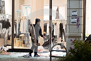 Looter leaving store with stolen clothing in downtown Seattle during riots on May 30, 2020.