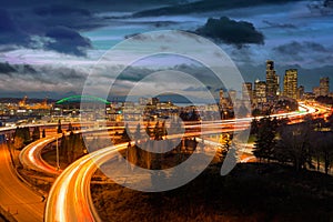 Seattle WA city skyline and freeway during sunset blue hour