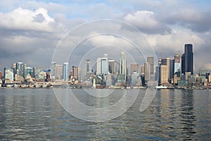 SEATTLE, WASHINGTON, USA - JAN 25th, 2017: A view on Seattle downtown from the waters of Puget Sound. Piers, skyscrapers
