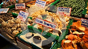 SEATTLE WASHINGTON USA - October 2014 - Mushrooms and truffles for sale in the high stalls at the Pike Place Market.