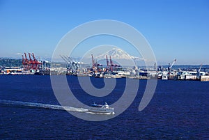 Seattle waterfront - dockyard cranes;  Mt. Rainier