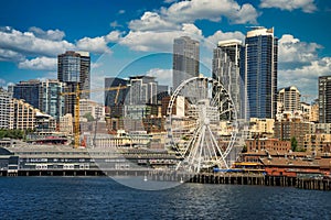 Seattle waterfront on Elliot Bay with the skyline of downtown and the Great Wheel