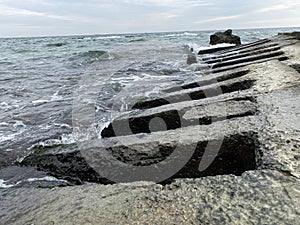 Seaview on gloomy day from rocky beach