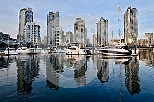 Seawall and boats in city marina.