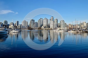 Seawall and boats in city marina.