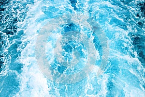 Seawater ship trail with white foam wave. Tropical island marine travel. Cruiseliner seawater trail. Blue ocean top view