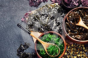 Seaweed assortment on fark background photo