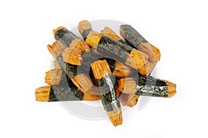 Seaweed wrapped rice crackers on white background