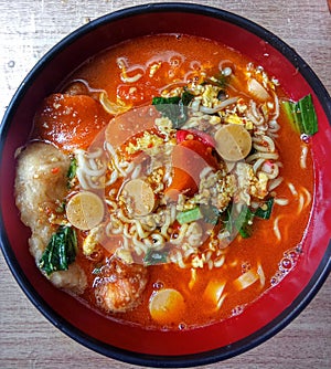 Seblak is spicy soup from sundanese cuisene photo
