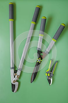 Secateurs, loppers, and hedge trimmers.Garden tools for topiary cutting of plants. Garden equipment and tools. Tools