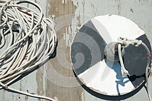 Secchi disk with rope on a wooden dock