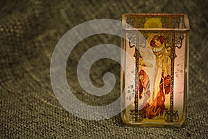 Secessionist style candlelight in a dim lit studio