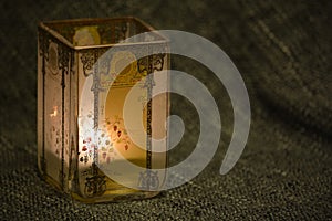 Secessionist style candlelight in a dim lit studio