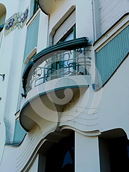 Secessionist style facade detail with balcony and green window photo