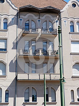 Secessionist style facade detail with balcony and white windows