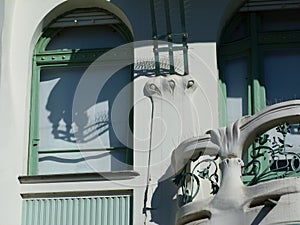 Secessionist style facade detail with balcony and white windows