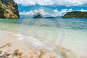 Secluded beach on Lagen island with view to Pinagbuyutan island. El Nido, Palawan, Philippines