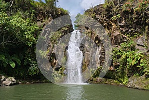 Secluded tropical waterfall photo