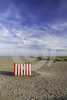 Secluded vacation getaway striped beach hut