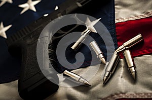 The second amendment and the right to bare arms concept with a grungy image of a gun and bullets on american flag. In the United