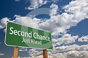 Second Chance Just Ahead Green Road Sign Over Sky photo
