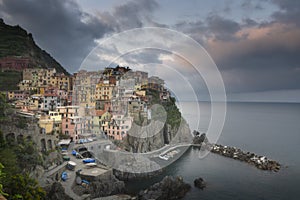 Second city of the Cique Terre sequence of hill cities - Manarola. Colorful spring sunset in Liguria, Italy