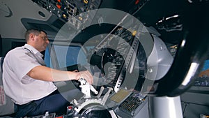 The second control wheel is moving simultaneously with the first one managed by a pilot